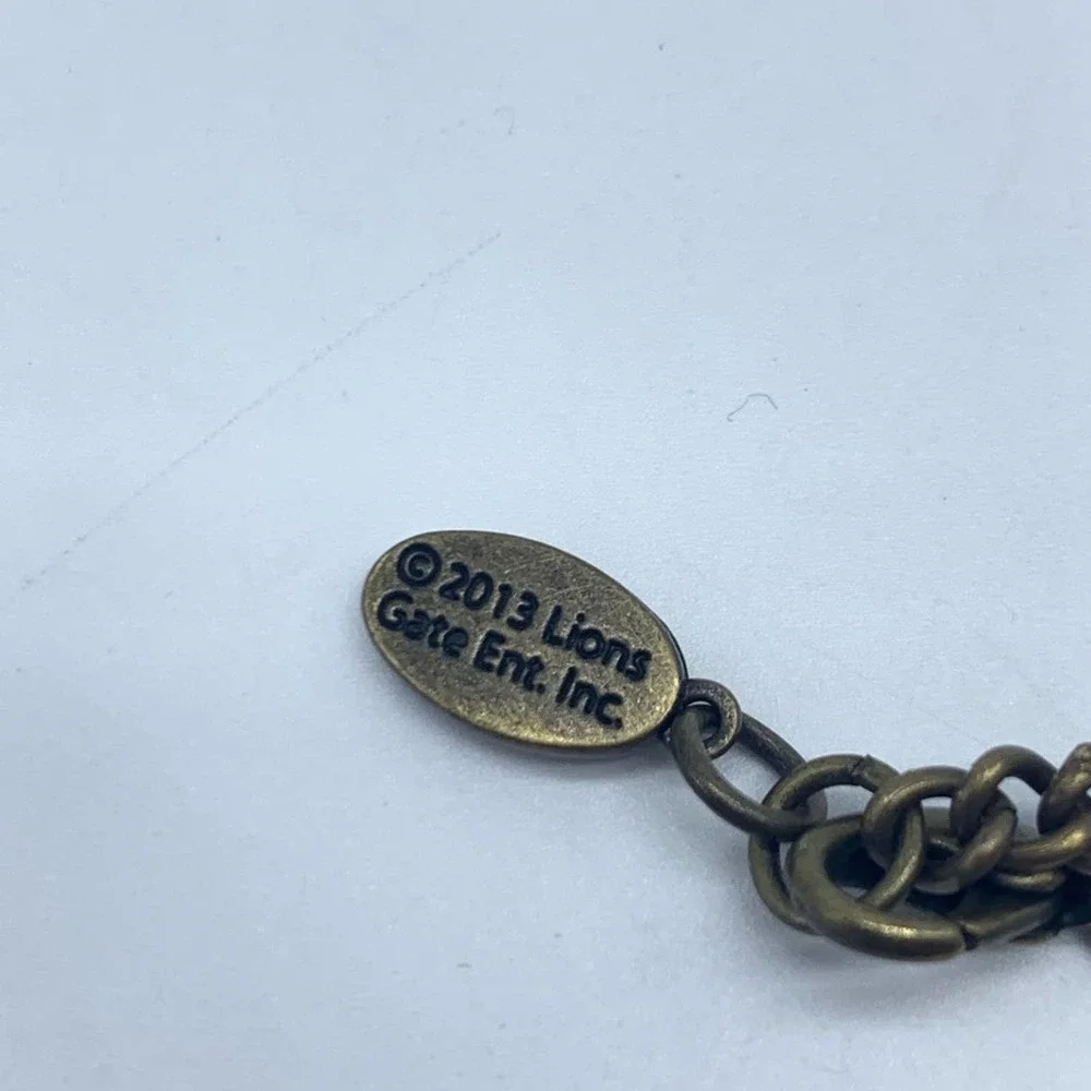 LION’S GATE Hunger Games Catching Fire District 12 necklace